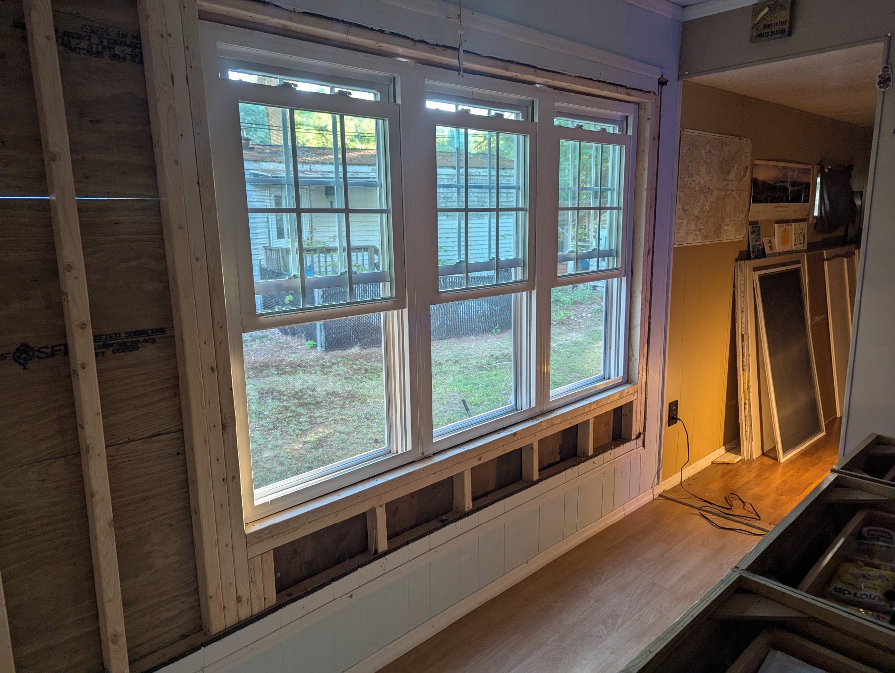 New triple double-hung windows installed in a reframed wall during a CRC renovation